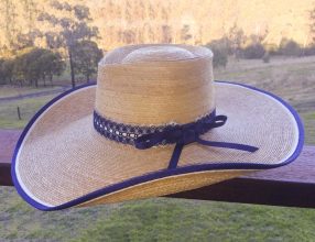 laced and loaded hat on balcony